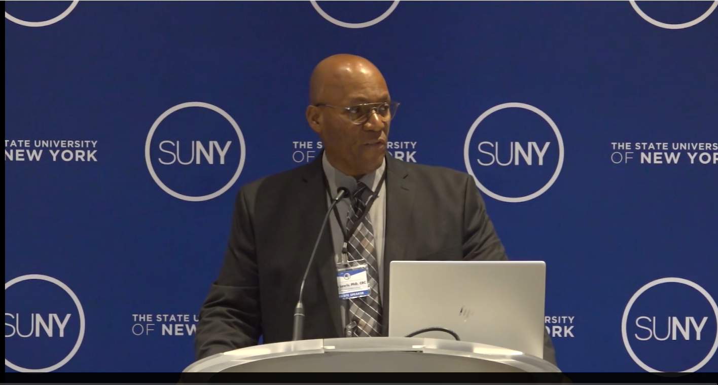 Dr. Allen Lewis delivering a keynote address at a SUNY convening.